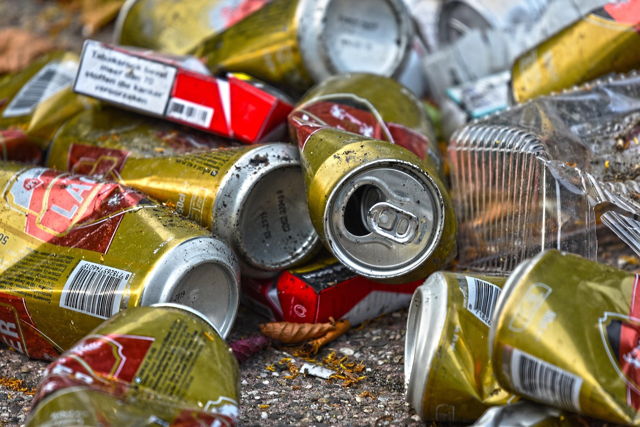 Dirty, crushed cans and litter